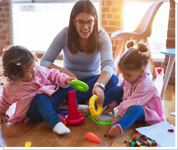 A happy mother or caregiver with two kids