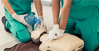 Two men learning CPR and rescue breathe