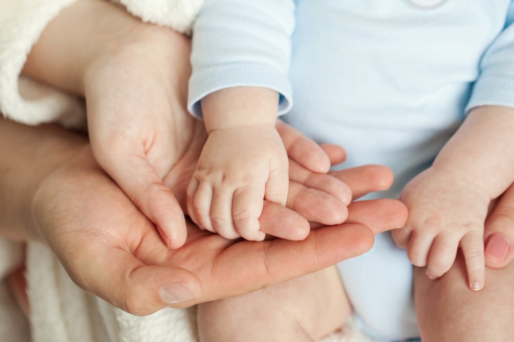 parents and infant hands