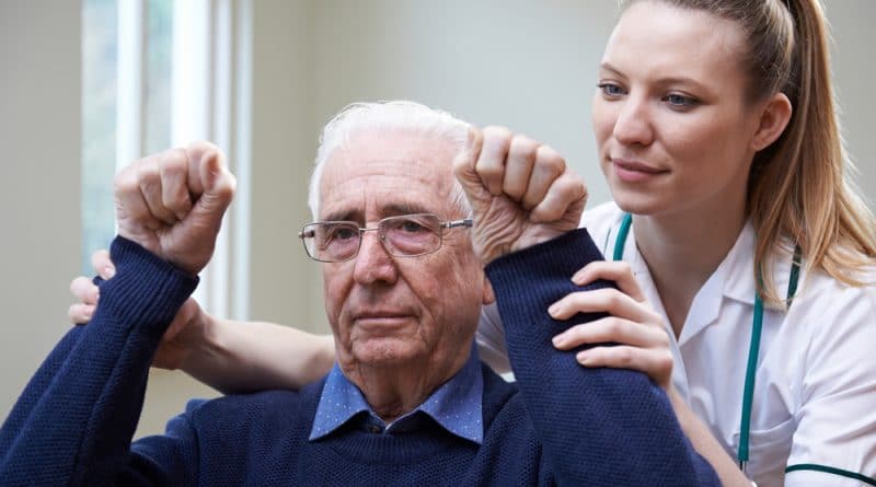 Exercise With Older Man and Nurse