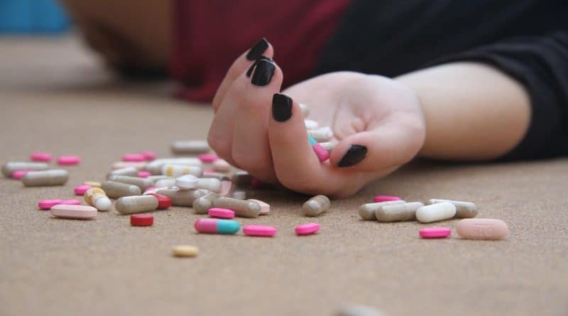 Hand Full of Pills and Fall