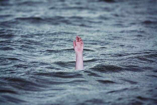 Hand Rising From the Water