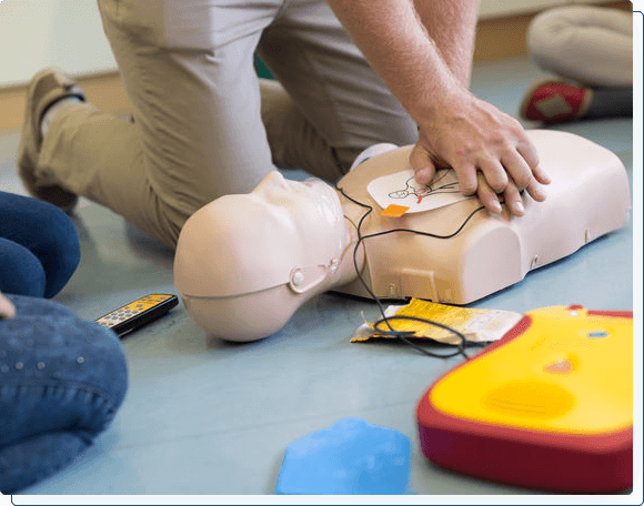 Using AED & performing CPR on adult mannequin