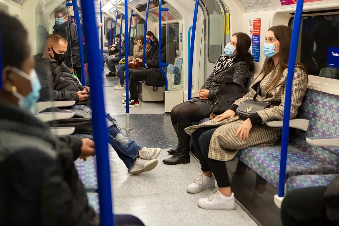 Passengers in a metro, travelling with masks on for ultimate safety.