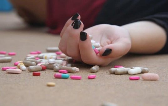 Hand Full of Pills and Fall